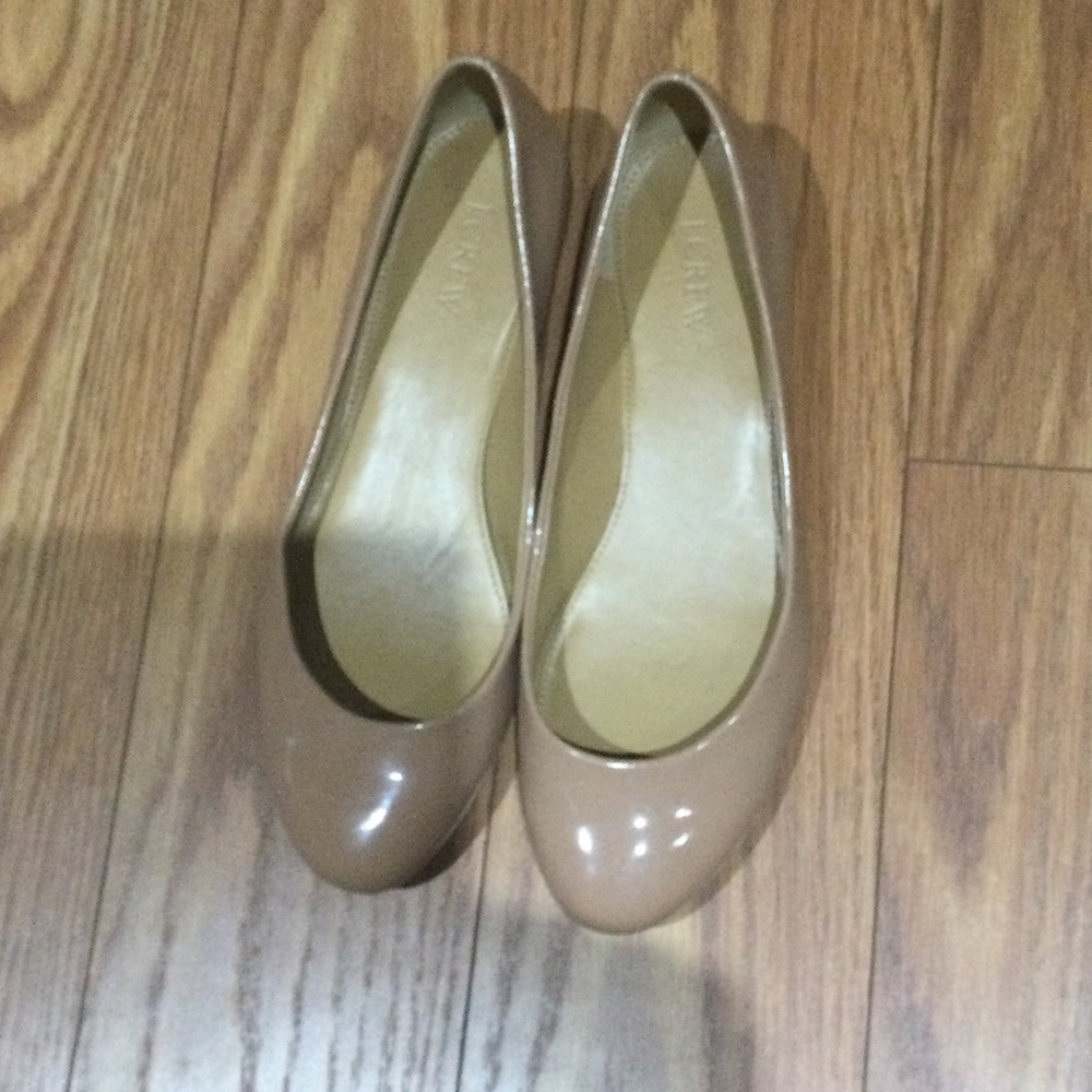 J. Crew nude flat with a slight gold heel. Size 8.5.